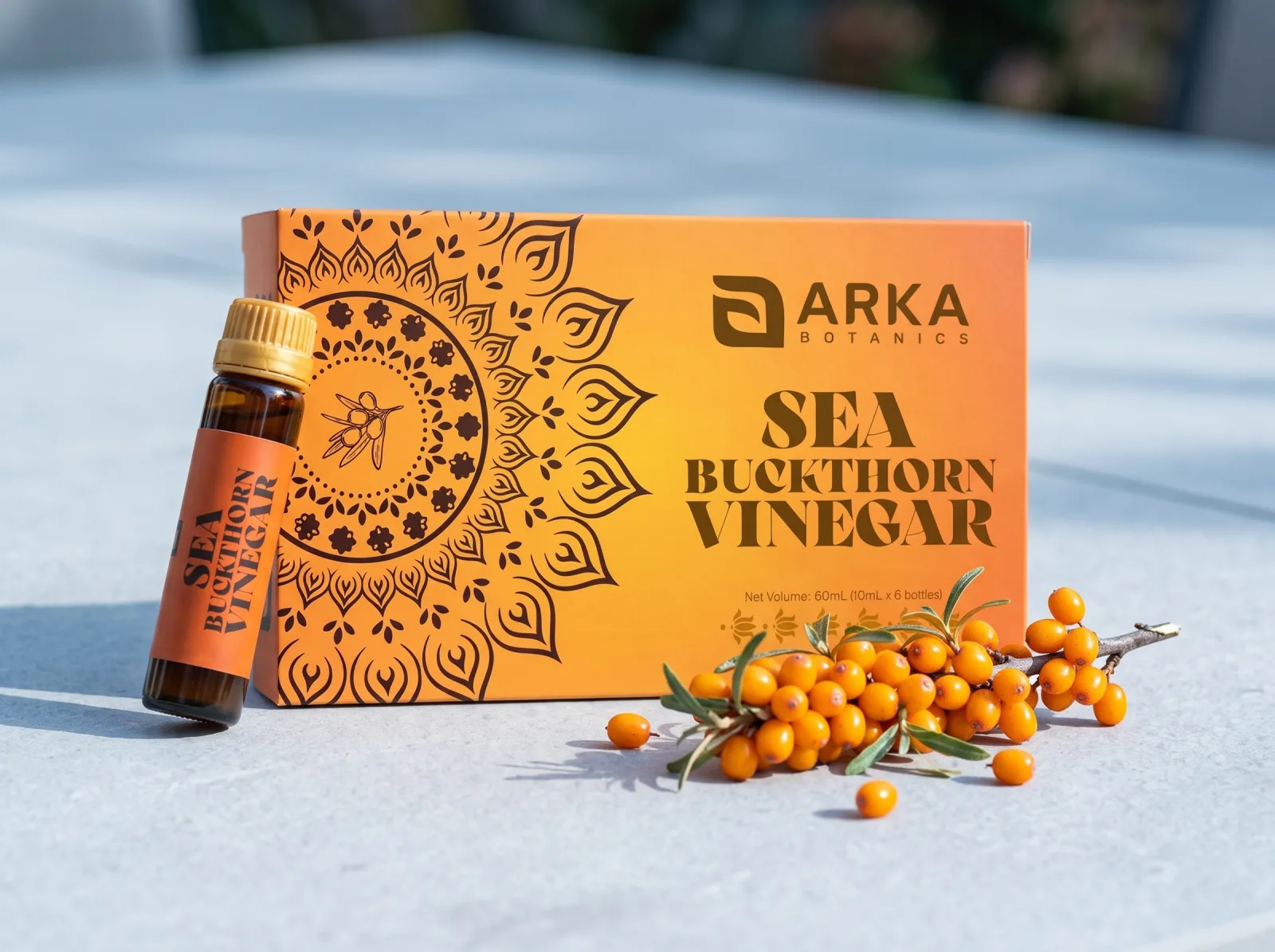 Sea Buckthorn Vinegar box and bottle in a lifestyle table setting